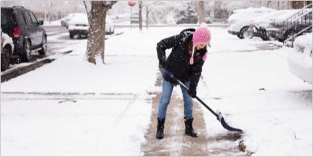 Woman shoveling snow thumbnail