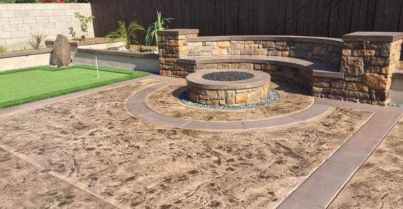 stamped concrete backyard makeover fire pit